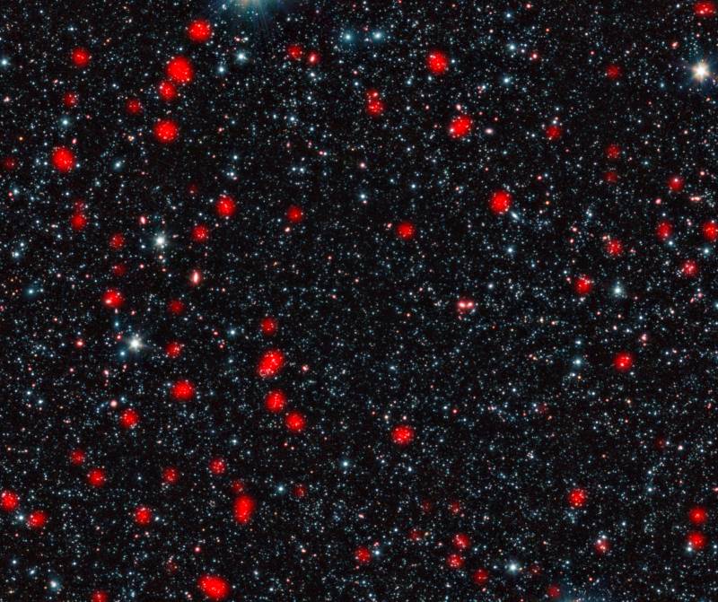 Galaxias distantes con estrellas en  formación en el universo temprano. Imagen: ESO, APEX, A. Weiss et al., NASA Spitzer S.C.