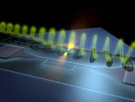 En la imagen se observa, en la parte inferior, el circuito superconductor donde los fotones de microondas interaccionan con un átomo artificial