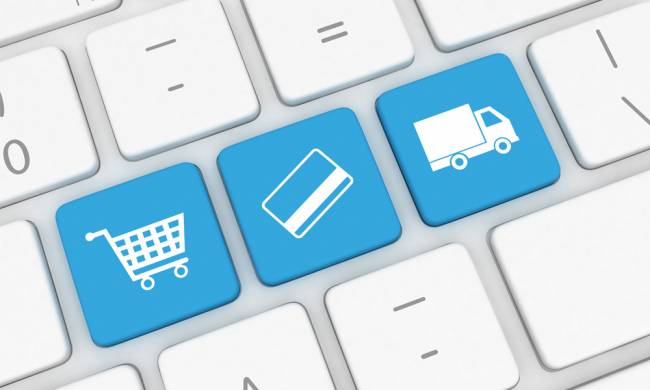 Imagen de un teclado cuyas teclas simbolizan el comercio electrónico. 