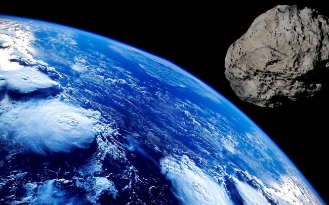 Ilustración de un asteroide dirigido a la Tierra
