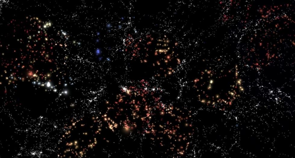 Las galaxias coloreadas representan las galaxias en vacíos usadas en CAVITY. El color y tamaño de las galaxias no está representado a escala. / Andoni Jiménez